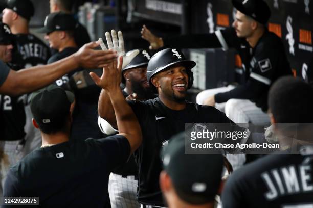 Elvis Andrus of the Chicago White Sox celebrates in the dugout after hitting a grand slam against the Minnesota Twins in the ninth inning at...