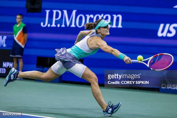 France's Alize Cornet hits a return to USA's Danielle Collins during their 2022 US Open Tennis tournament women's singles third round match at the...