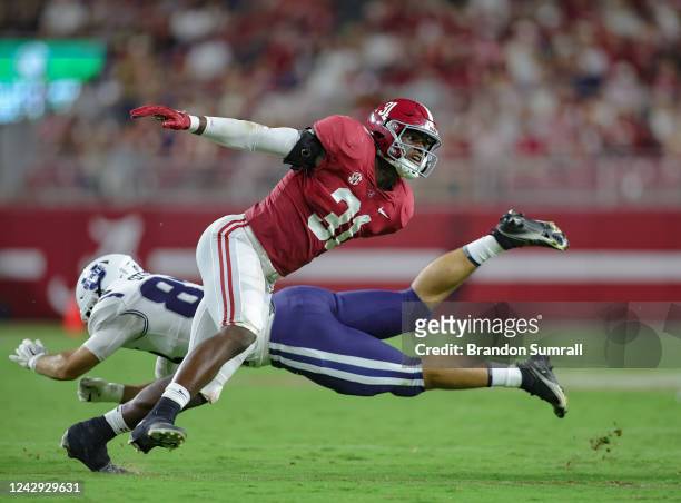 Will Anderson Jr. #31 of the Alabama Crimson Tide throws aside Josh Sterzer of the Utah State Aggies at Bryant Denny Stadium on September 3, 2022 in...