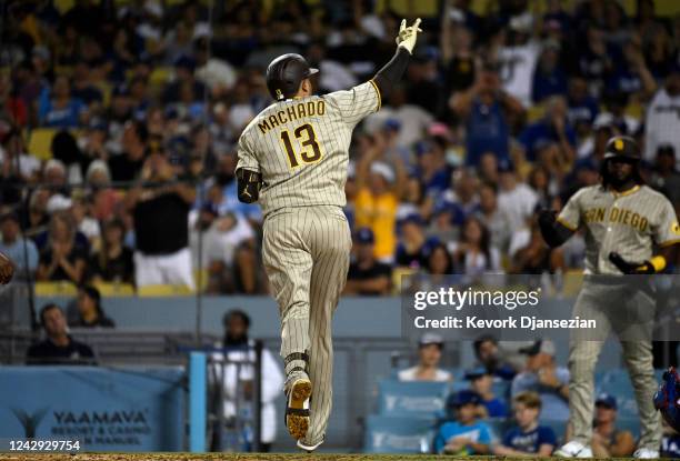 Manny Machado of the San Diego Padres celebrates after hitting a solo home run against starting pitcher Julio Urias of the Los Angeles Dodgers during...