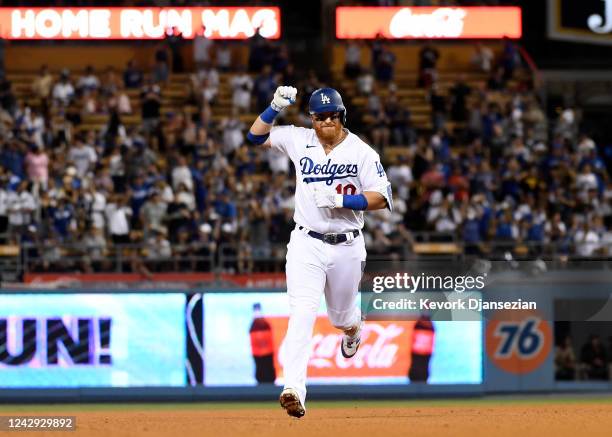 Justin Turner of the Los Angeles Dodgers celebrates after hitting a two-run home run during the fifth inning against starting pitcher Sean Manaea of...