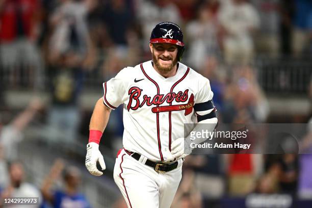 Robbie Grossman of the Atlanta Braves smiles after taking a walk to win the game against the Miami Marlins during the ninth inning at Truist Park on...