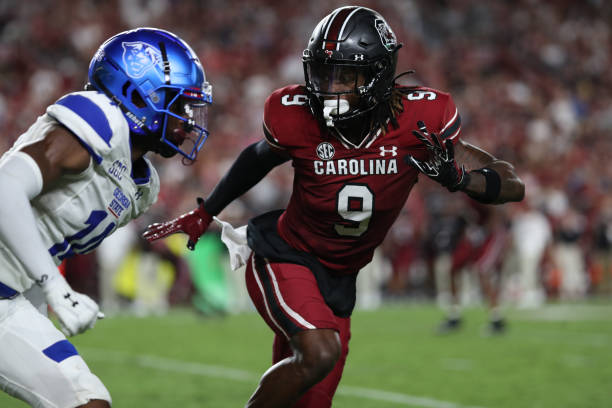 South Carolina Gamecocks defensive back Cam Smith turns and runs with Georgia State Panthers wide receiver Robert Lewis during a football game
