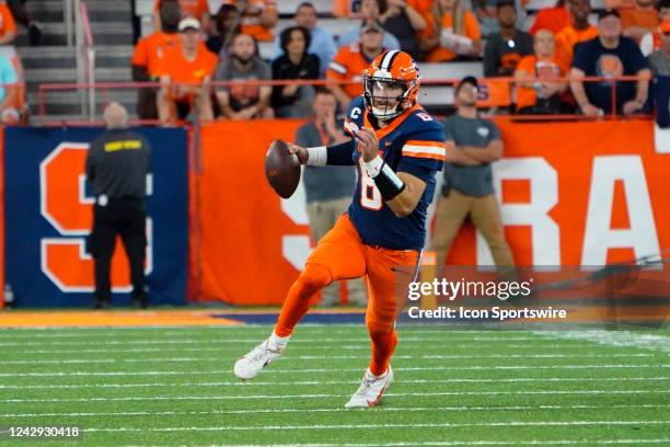 Syracuse Orange Quarterback Garrett Shrader rolls out looking to pass the ball during the first half of the college football game between the...