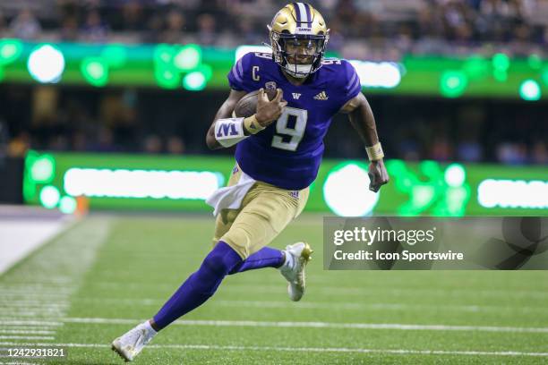 Washington Huskies quarterback Michael Penix Jr. Runs with the ball during a college football game between the Kent State Golden Flashes and the...