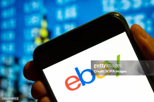 In this photo illustration, the American multinational e-commerce online auction and shopping company Ebay logo is displayed on a smartphone screen.