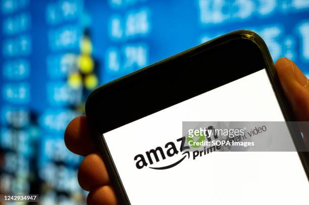 In this photo illustration, the American Internet video on demand service owned by Amazon company, Amazon Prime, logo is displayed on a smartphone...