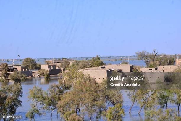 View of damaged houses hit by floodwater following flash flood in Sewan Sharif, southern Sindh province, Pakistan on September 04, 2022 The death...