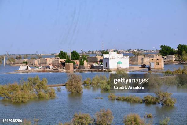 View of damaged houses hit by floodwater following flash flood in Sewan Sharif, southern Sindh province, Pakistan on September 04, 2022 The death...