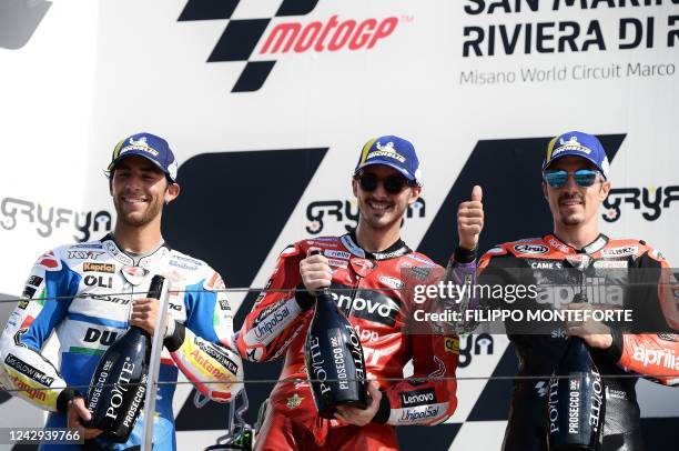 First-placed Ducati Lenovo's Italian rider Francesco Bagnaia , second-placed Ducati Gresini Racing's Italian rider Enea Bastianini and third-placed...