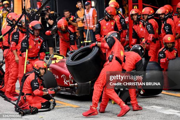 Mechanic carries a tire for Ferrari's Spanish driver Carlos Sainz Jr in the pits of the Zandvoort circuit during the Dutch Formula One Grand Prix on...