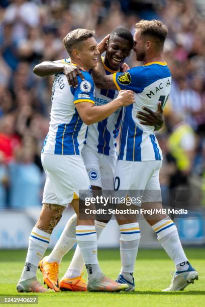 Moises Caicedo of Brighton & Hove Albion celebrates with Leandro Trossard and Alexis Mac Allister after scoring goal during the Premier League match...