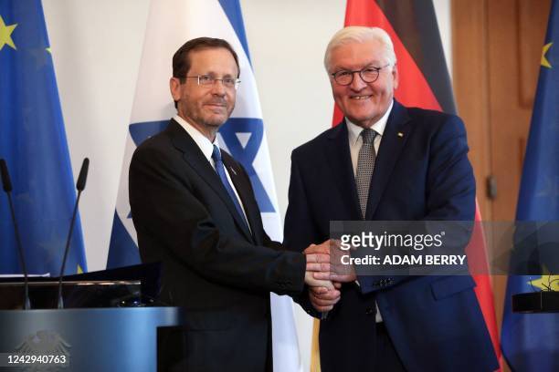 German President Frank-Walter Steinmeier and Israel's President Isaac Herzog shake hands after addressing a joint press conference at the...