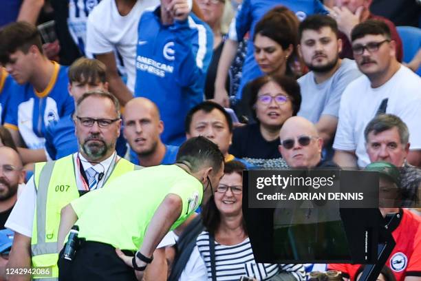 English referee Tony Harrington looks at the VAR before disallowing Brighton's third goal scored by Brighton's Argentinian midfielder Alexis Mac...