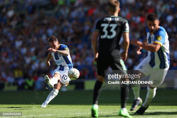 Brighton's Argentinian midfielder Alexis Mac Allister shoots a free kick and scores his team fifth goal during the English Premier League football...