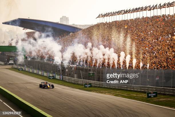 Max Verstappen crosses the finish line after winning the F1 Grand Prix of the Netherlands at Circuit van Zandvoort on September 4, 2022 in Zandvoort,...