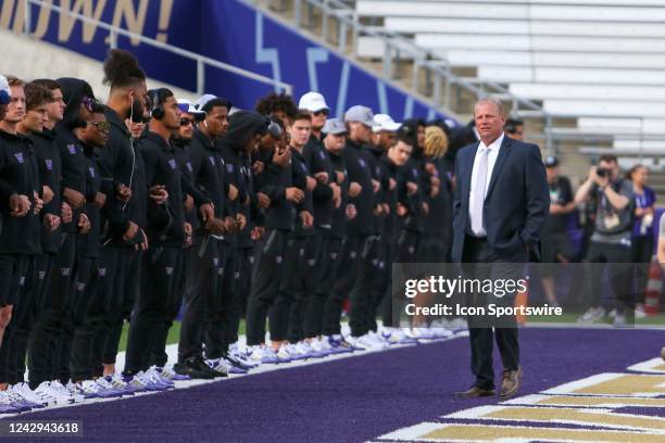 September 03: Washington head coach Kalen DeBoer walks with players before the game between the Washington Huskies and the Kent State Golden Flashers...