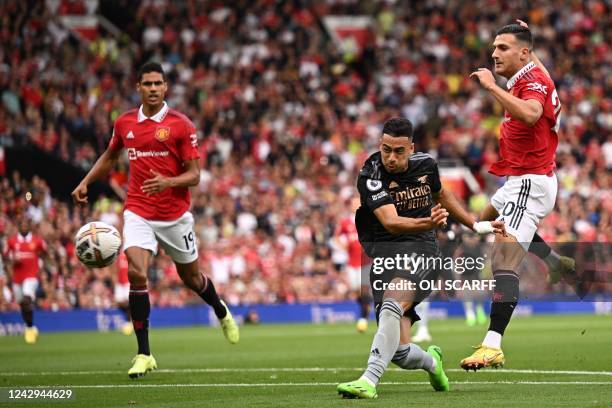 Arsenal's Brazilian midfielder Gabriel Martinelli shoots to score the opening goal which is then disallowed for a foul in the build-up during the...