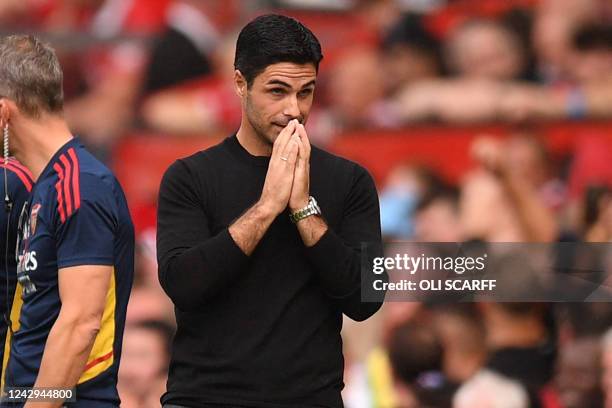 Arsenal's Spanish manager Mikel Arteta reacts after their first goal is disallowed after a VAR review during the English Premier League football...