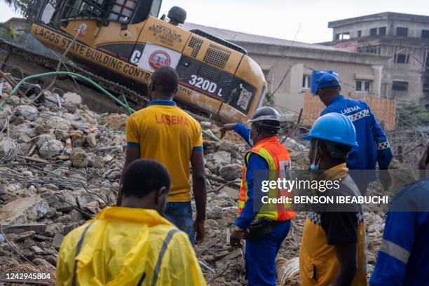 Lagos State Emergency Management Agency officials coordinate rescue work at the site of a building collapse in Lekki, Lagos on September 4 after an...