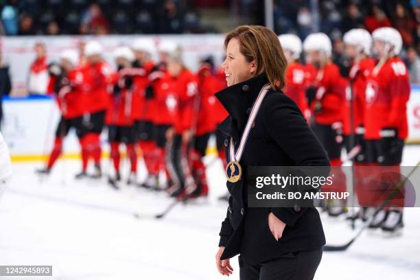 Czechia's head Coach Carla Macleod celebrates with her bronze medal after the women's IIHF World Championship ice hockey bronze medal match between...