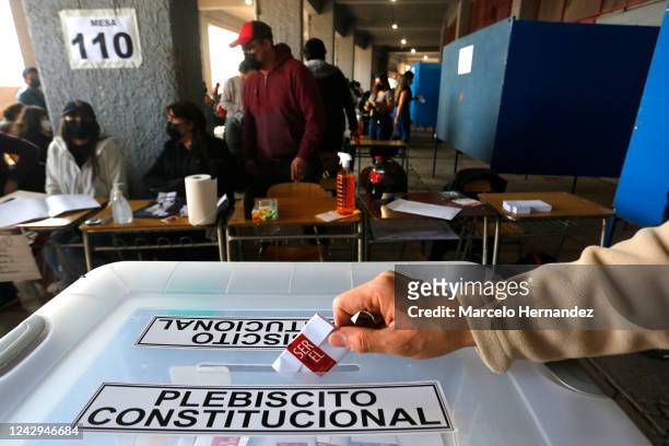 Man casts his vote during the referendum to approve or reject the new constitution on September 4, 2022 in Santiago, Chile. The draft would replace...