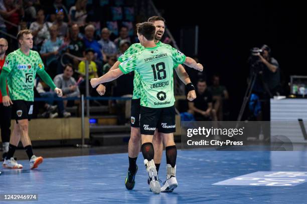 Fabian Wiede and Hans Lindberg of the Fuechse Berlin celebrate during the Liqui Moly Handball Bundesliga match between the Fuechse Berlin against...