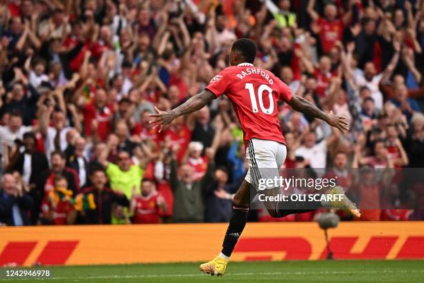 Manchester United's English striker Marcus Rashford celebrates after scoring their second goal during the English Premier League football match...