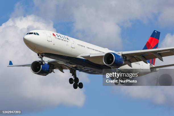 Delta Air Lines Airbus A330 aircraft as seen flying over Myrtle avenue during a summer day for landing at London Heathrow Airport LHR, a famous spot...