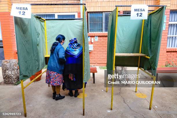 Mapuche woman casts her vote during a referendum to approve or reject a new Constitution at a polling station in Temuco, Chile, on September 4, 2022....