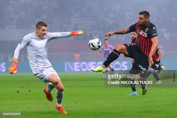 Nice's Algerian forward Andy Delort vies for the ball with Monaco's German goalkeeper Alexander Nubel during the during the French L1 football match...