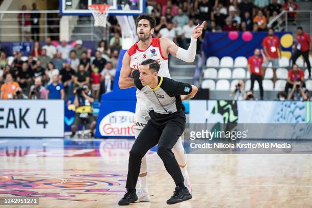 The referee protect Furkan Korkmaz of Turkey from the other players during the FIBA EuroBasket 2022 group A match between Turkey and Georgia at...