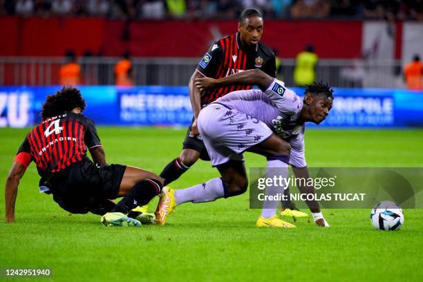 Monaco's Swiss forward Breel Embolo fights for the ball with Nice's Brazilian defender Dante during the French L1 football match between OGC Nice and...