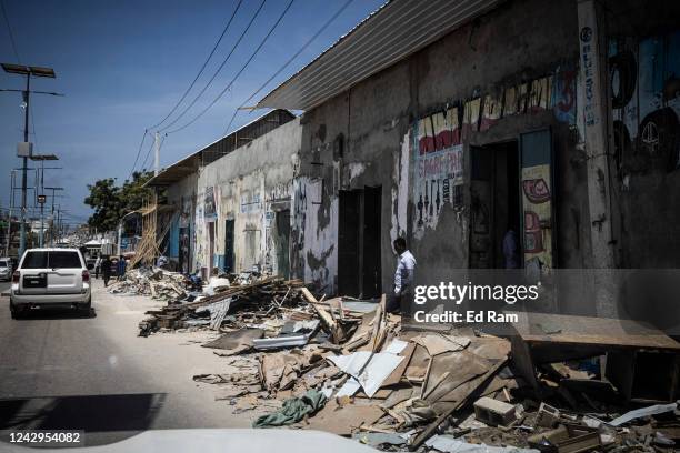 Rubble lies on the floor near the site of a recent Al Shabab attack on the Hayat Hotel, seen through the window of an armoured car on September 4,...