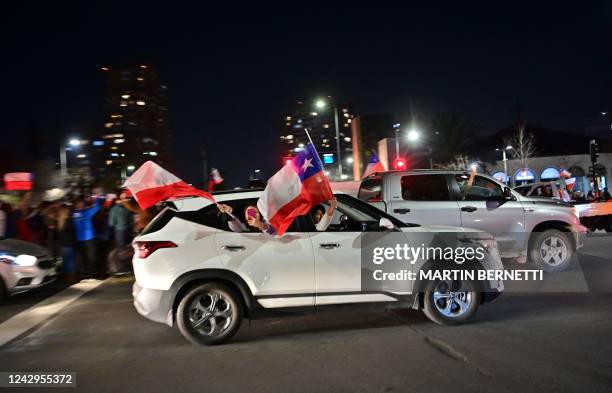 People rejecting the new constitution draft celebrate after learning the fist results of the referendum vote, in Santiago, on September 4, 2022. -...