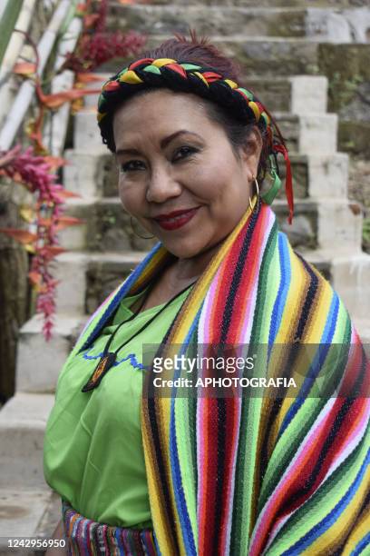 An Indigenous woman poses for a picture during a ceremony on International Indigenous Women's Day on September 4, 2022 in Sonsonate, El Salvador....