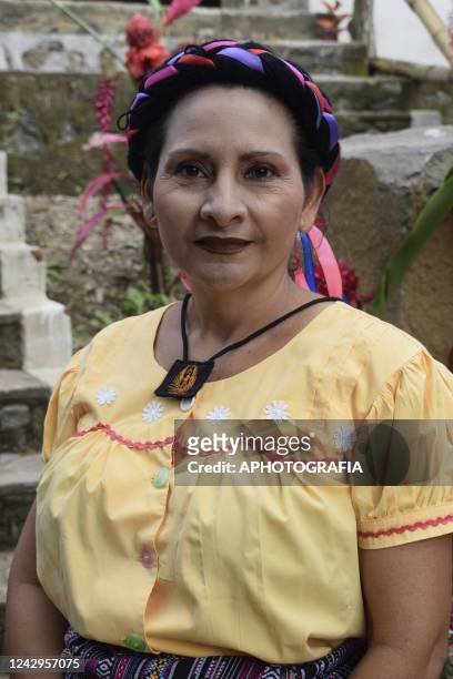 An Indigenous woman poses for a picture during a ceremony on International Indigenous Women's Day on September 4, 2022 in Sonsonate, El Salvador....