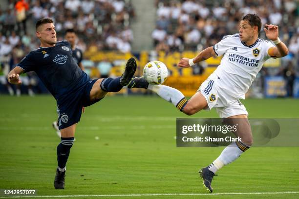 Javier Hernández of Los Angeles Galaxy battles Erik Thommy of Sporting Kansas City during the match at the Dignity Health Sports Park on September 4,...