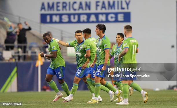 Sounders players celebrate a second half Seattle goal during an MLS game between the Houston Dynamo and Seattle Sounders on September 4, 2022 at...