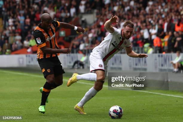 Hull City's Oscar Estupinan battles for possession with Sheffield United's Rhys Norrington-Davies during the Sky Bet Championship match between Hull...