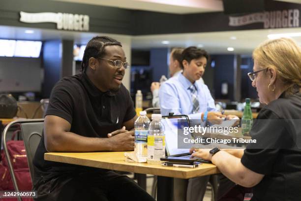 Earvie Howard interviews for a ramp services job at a United Airlines career fair on Aug. 16 at the United Center in Chicago. United hosted the job...