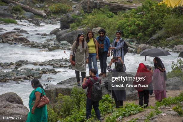 Group of Indian tourists take their pictures on September 4, 2022 in Chandanwari 112 Km south Srinagar, Indian administered Kashmir, India. Pahalgam...