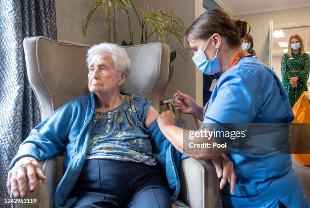 Registered Nurse Laura Hastings administers a covid booster to Agnes Taylor at Victoria Manor Care home on September 5 in Edinburgh, Scotland. Today...