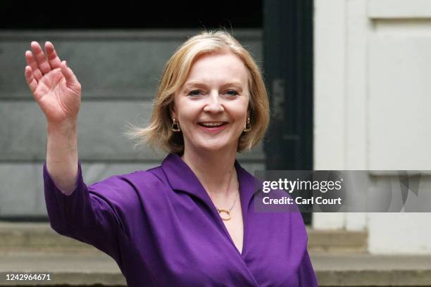 New Conservative Party leader and incoming prime minister Liz Truss waves as she leaves Conservative Party Headquarters on September 5, 2022 in...