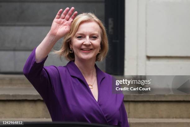 New Conservative Party leader and incoming prime minister Liz Truss waves as she leaves Conservative Party Headquarters on September 5, 2022 in...