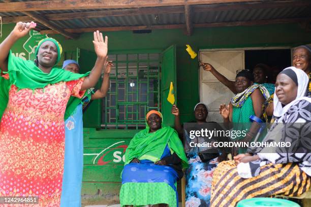 Supporters of Kenyan President elect William Ruto celebrates in Kibera, Nairobi on September 5 following Kenya's Supreme Court upholding of Ruto's...