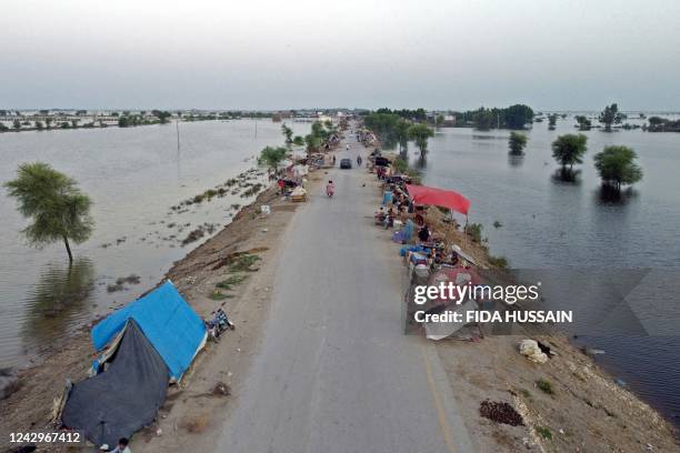 This aerial photograph taken on September 5, 2022 shows the makeshift tents of internally displaced flood-affected people after heavy monsoon rains...