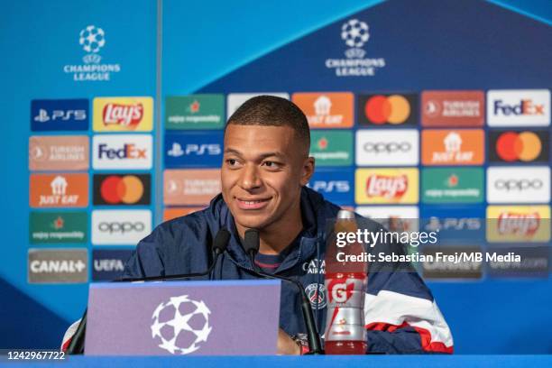 Kylian Mbappe of Paris Saint-Germain smile during the press conference ahead of their UEFA Champions League group H match against Juventus, at Camp...