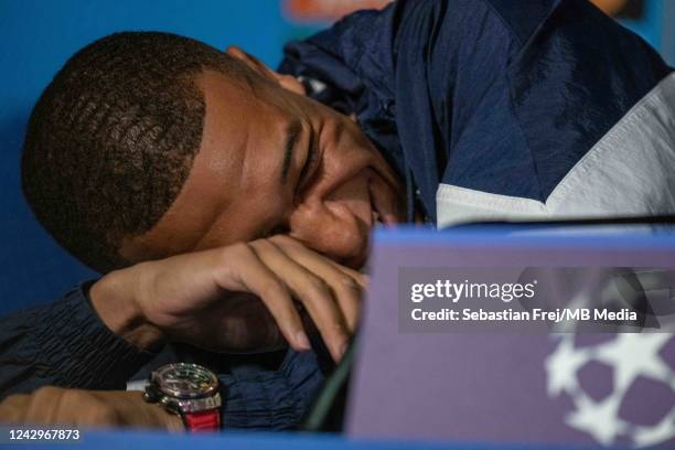 Kylian Mbappe of Paris Saint-Germain smile during the press conference ahead of their UEFA Champions League group H match against Juventus, at Camp...