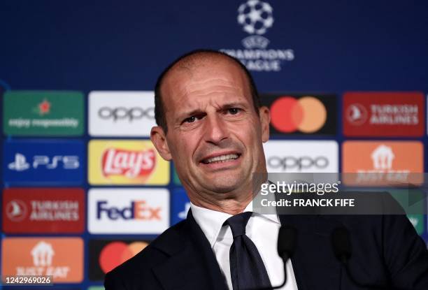 Juventus' Italian head coach Massimiliano Allegri grimaces during a press conference at the Parc des Princes stadium in Paris on September 5, 2022 on...